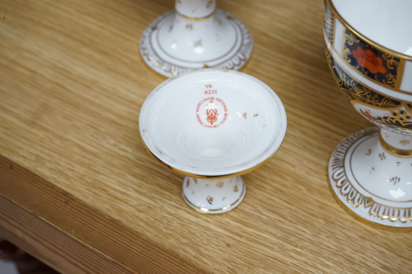 A group of six Royal Crown Derby stemmed cups (one cup and stem detached). 12.5cm high